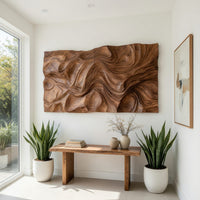 Rectangular dune textured wood wall relief in a bright sunroom with green plants