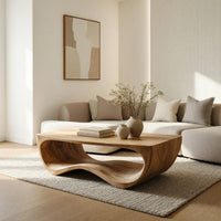 Curved side coffee table with a wave tunnel in a bright modern living room
