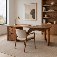 Executive desk with oval ring leg and curved back panel in a Scandinavian home office with white walls