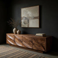 TV cabinet with four faceted sculpted doors, three-quarter view showing the grain