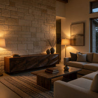 TV cabinet with four faceted sculpted doors in an evening room lit by two lamps