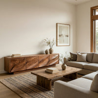 TV cabinet with four faceted sculpted doors in a bright modern living room