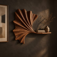 Fan shaped leaf wall art with carved ribs and a small ledge, three-quarter view showing the carved depth