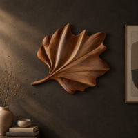 Fan shaped wooden leaf with raised ribs and a ruffled edge, three-quarter view showing the carved depth