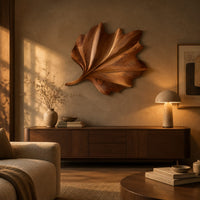 Fan shaped wooden leaf with raised ribs and a ruffled edge above a low console in an evening living room