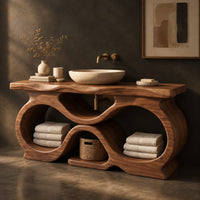 Corner detail of freestanding bathroom vanity with a figure eight base and slab top beside wood, brass and linen samples