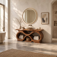 Freestanding bathroom vanity with a figure eight base and slab top in a bright open plan bathroom
