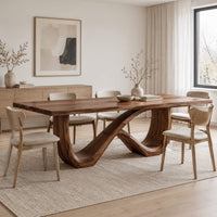 Rectangular dining table on an infinity loop base of curved wood in a Scandinavian dining room with white walls