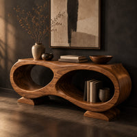 Corner detail of console table shaped like a figure eight with two oval openings beside wood, brass and linen samples