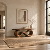 Bench with a smooth flat seat on a figure eight loop base in a bright open plan entryway