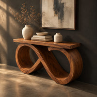 Console table with an infinity loop base and a plank top, three-quarter view showing the grain