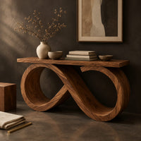 Corner detail of console table with an infinity loop base and a plank top beside wood, brass and linen samples