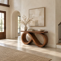 Console table with an infinity loop base and a plank top in a bright open plan entryway