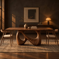 Dining table on a single figure eight loop base with two open holes in a dark dining room at golden hour