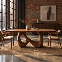Dining table on a single figure eight loop base with two open holes in an industrial loft dining room with exposed brick