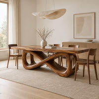 Rectangular dining table on a figure eight loop base with a thick plank top in a Scandinavian dining room with white walls