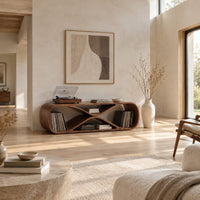 Low record console shaped like a figure eight with open bays at each end in a bright open plan living room