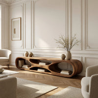 Low loop TV stand with carved figure eight openings in a bright modern living room