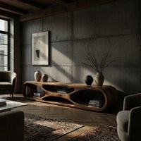 Low loop TV stand with carved figure eight openings in a concrete and timber loft