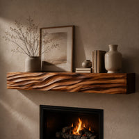 Corner detail of thick mantel beam with a carved wave pattern along the front beside wood, brass and linen samples