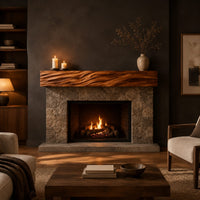Thick mantel beam with a carved wave pattern along the front in a dark living room at golden hour