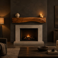 Fireplace mantel with carved flowing grain ridges and a wavy lower edge in a dark living room at golden hour
