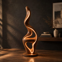 Flame shaped floor lamp with a glowing edge and a small shelf, three-quarter view showing the grain