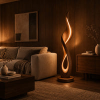 Flame shaped floor lamp with a glowing teardrop opening on a disc base in an evening living room with walnut wall paneling