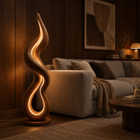 Flame shaped wooden floor lamp with a glowing loop on a disc base in an evening living room with walnut wall paneling
