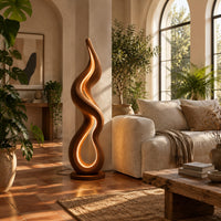 Flame shaped wooden floor lamp with a glowing loop on a disc base in a bright living room with arched windows and plants