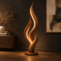 Flame shaped floor lamp with layered tongues and a glowing seam, three-quarter view showing the grain