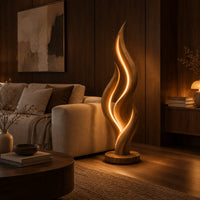 Flame shaped floor lamp with layered tongues and a glowing seam in an evening living room with walnut wall paneling