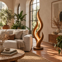 Flame shaped floor lamp with layered tongues and a glowing seam in a bright living room with arched windows and plants