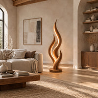 Flame shaped floor lamp with layered tongues and a glowing seam in a bright open plan living room
