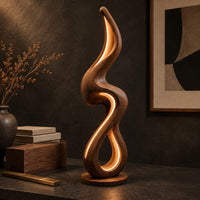 Corner detail of flame shaped floor lamp with a looping wooden ribbon and glowing inner edge beside wood, brass and linen samples