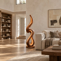 Flame shaped floor lamp with a looping wooden ribbon and glowing inner edge in a bright open plan living room