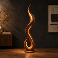 Flame shaped floor lamp with an open loop base and inner glow in a dark studio against a charcoal plaster wall