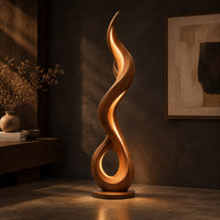Flame shaped floor lamp with an open loop base and inner glow, three-quarter view showing the grain