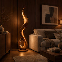 Flame shaped floor lamp with an open loop base and inner glow in an evening living room with walnut wall paneling