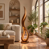 Flame shaped floor lamp with an open teardrop loop and a glowing edge in a bright living room with arched windows and plants