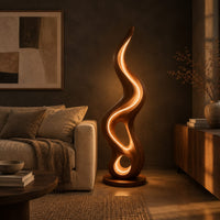 Flame shaped wooden lamp with open loops and a glowing edge line in a dark living room at golden hour