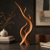 Corner detail of flame shaped wood sculpture with a long sweeping arm and an open loop beside wood, brass and linen samples