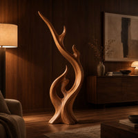 Flame shaped wood sculpture with a long sweeping arm and an open loop in an evening living room with walnut wall paneling