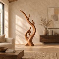 Flame shaped wood sculpture with a long sweeping arm and an open loop in a bright open plan living room