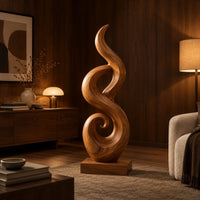 Flowing flame sculpture with a spiral scroll at its foot and a block base in an evening living room with walnut wall paneling