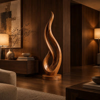 Flame shaped wood sculpture with an open loop on a disc base in an evening living room with walnut wall paneling