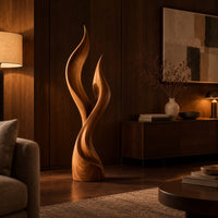 Wood sculpture shaped like two rising flames with smooth swept lines in an evening living room with walnut wall paneling