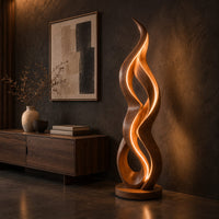 Floor lamp shaped like a twisting flame on a flat disc base, three-quarter view showing the grain