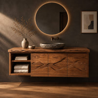 Floating wooden vanity cabinet with carved ridge line fronts and open end shelves in a dark studio against a charcoal plaster wall