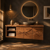 Floating wooden vanity cabinet with carved ridge line fronts and open end shelves in a dark bathroom at golden hour